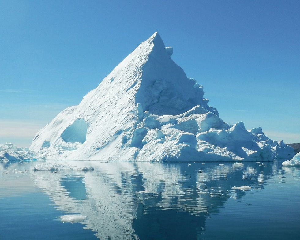 Trianglar shaped iceberg in the sea